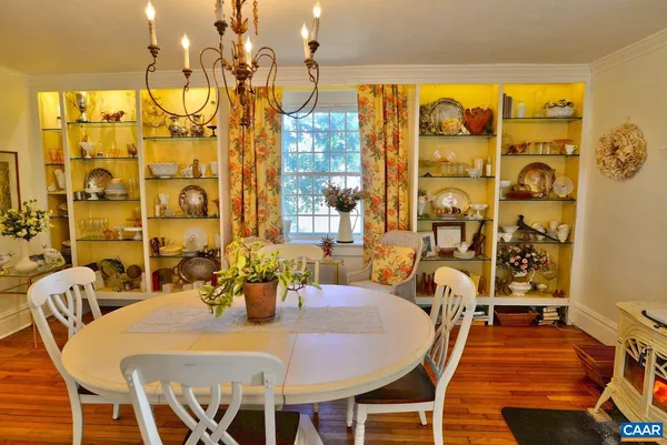 a dining room with a table and chairs