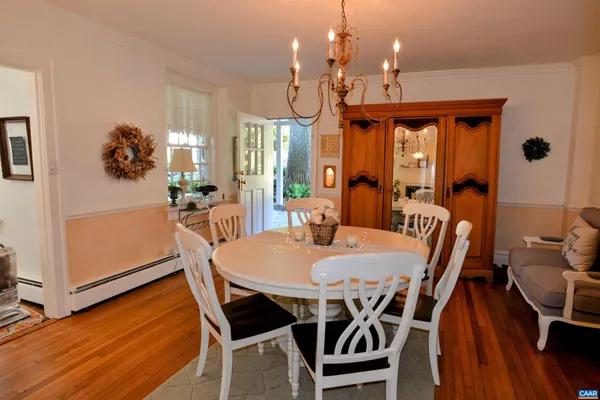 a dining room with furniture and window