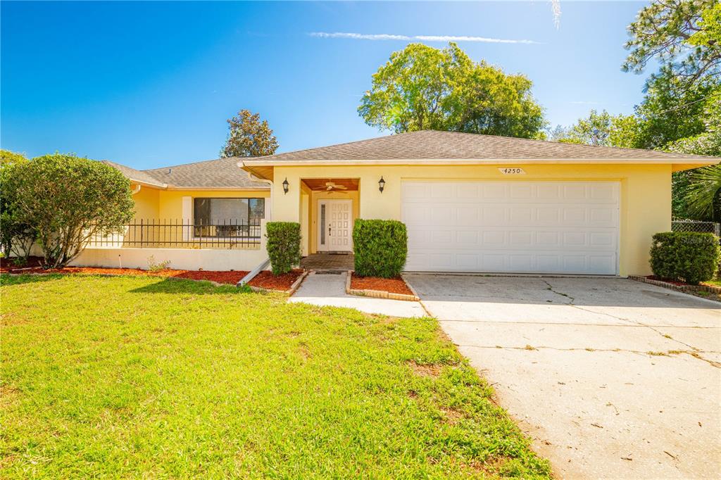 a front view of house with yard and seating area