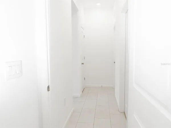 a view of empty room with windows