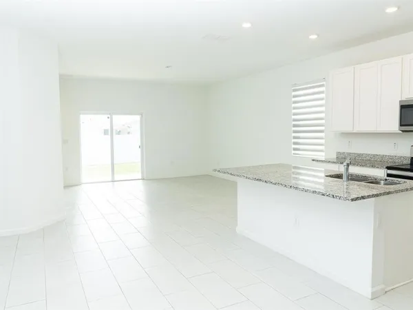 a house that has a big yard and large trees