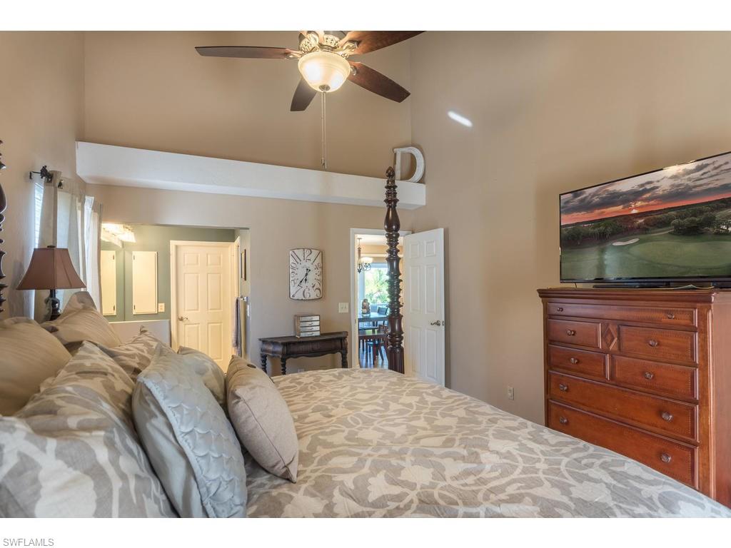 17208 Trellis Road Fort Myers, FL 33967 - Photo 11 of 22 a bedroom with a bed and a flat screen tv