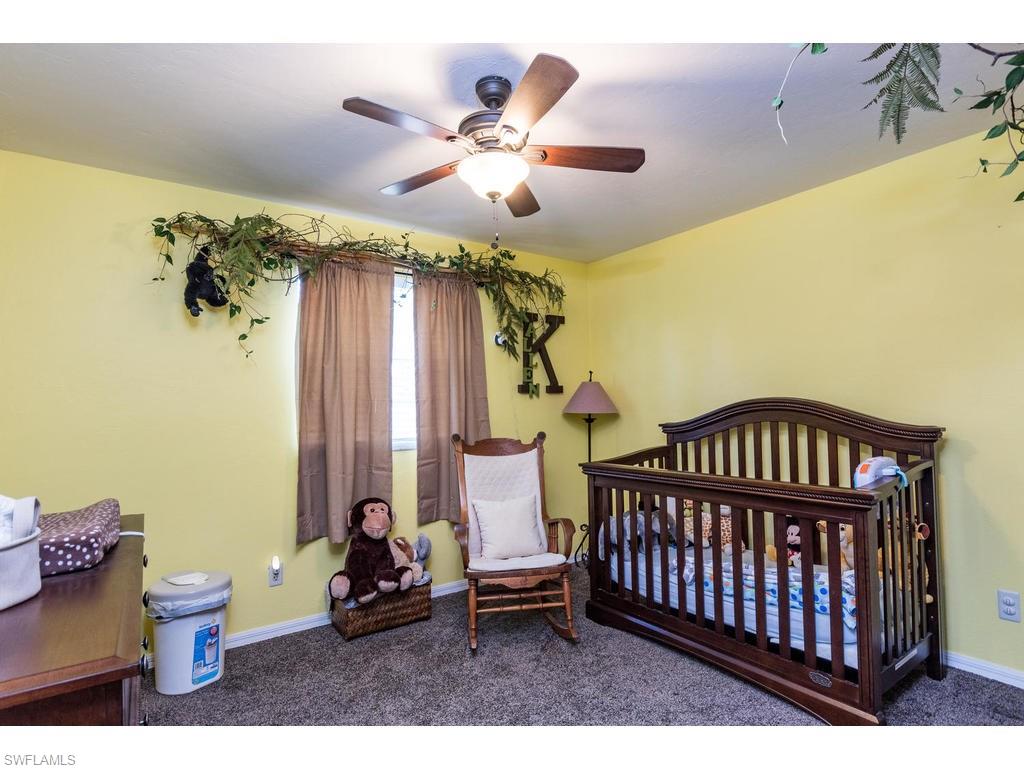 17208 Trellis Road Fort Myers, FL 33967 - Photo 14 of 22 a bedroom with furniture and a window
