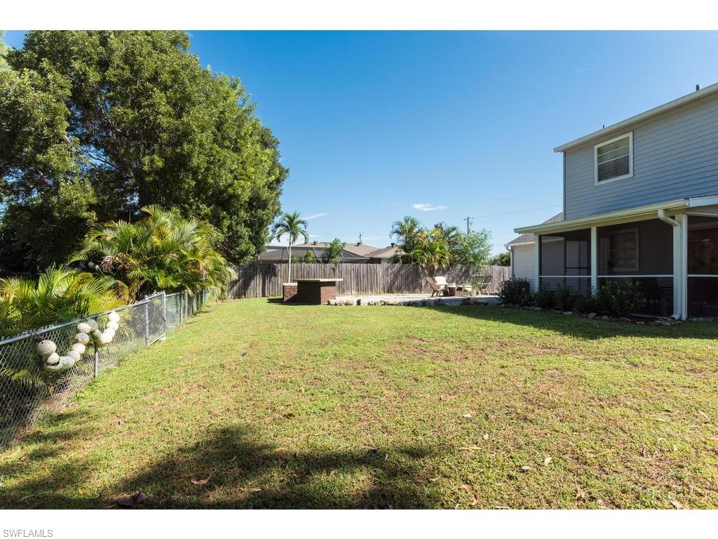 17208 Trellis Road Fort Myers, FL 33967 - Photo 21 of 22 a front view of a house with a yard