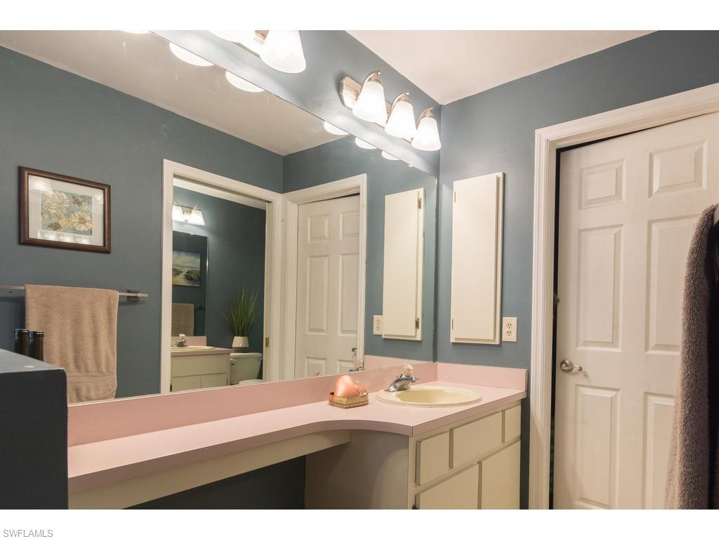 17208 Trellis Road Fort Myers, FL 33967 - Photo 8 of 22 a bathroom with a sink a large mirror and a shower