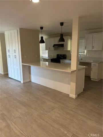 a view of kitchen and utility room
