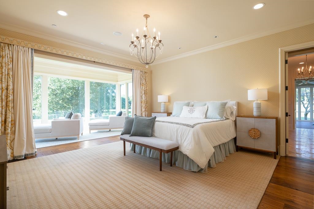 45 Pisgah Road Eads, TN 38028 - Photo 17 of 40 a spacious bedroom with a bed and a chandelier