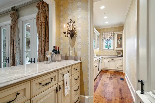 a spacious bathroom with a granite countertop sink mirror and a bath tub