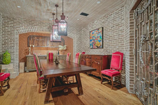 a dining room with furniture and wooden floor