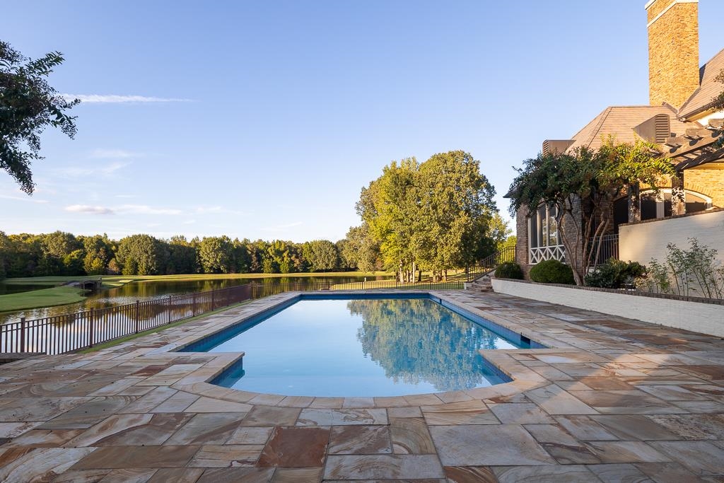 45 Pisgah Road Eads, TN 38028 - Photo 37 of 40 a view of a swimming pool with a lounge chair
