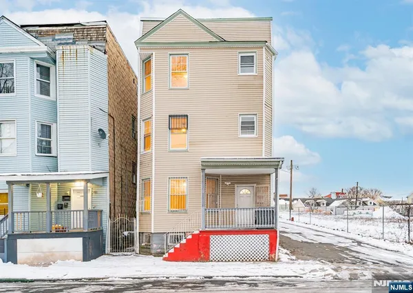 a view of a brick house with many windows