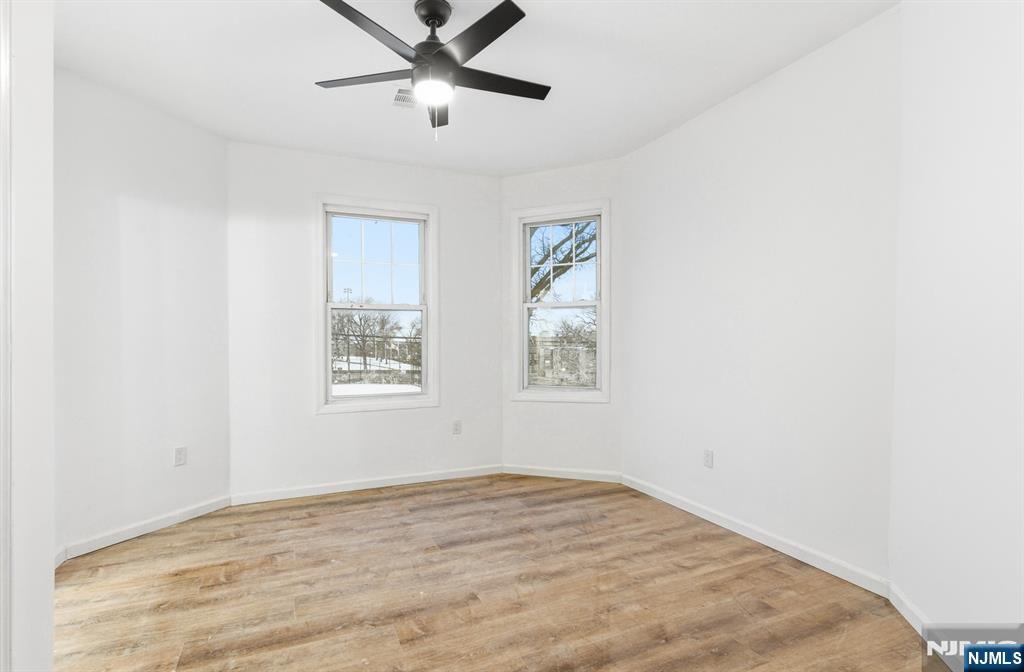 528 South 13th Street, Unit 2 Newark, NJ 07103 - Photo 11 of 21 a view of empty room with wooden floor and fan