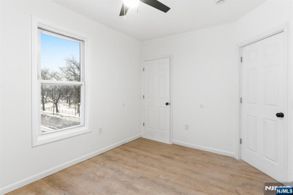 528 South 13th Street, Unit 2 Newark, NJ 07103 - Photo 17 of 21 an empty room with windows and closet