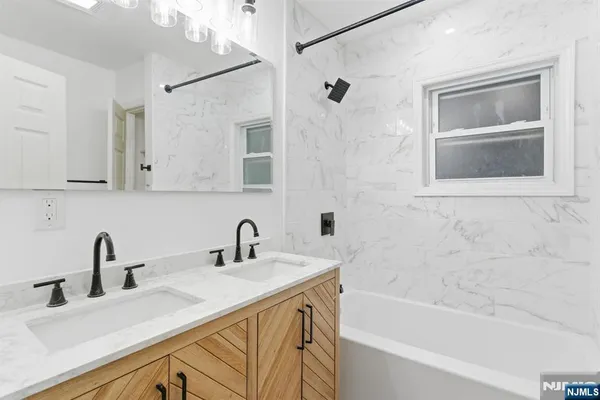 a white toilet sitting next to a bath tub