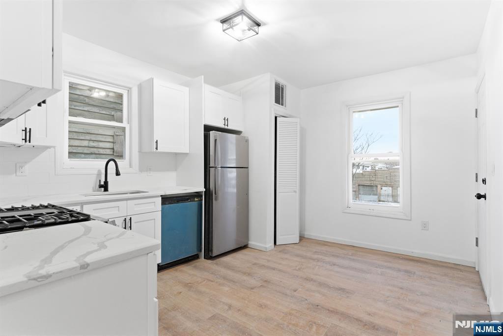 528 South 13th Street, Unit 2 Newark, NJ 07103 - Photo 8 of 21 a kitchen with a refrigerator stove and sink