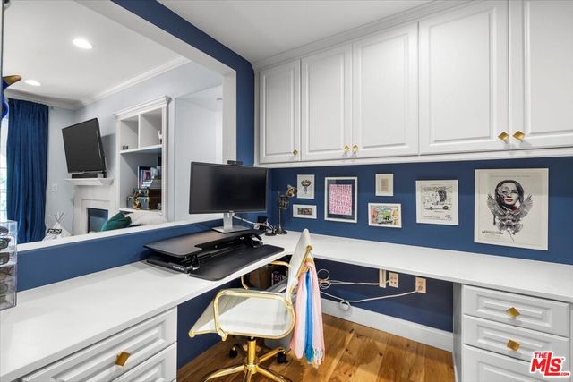 a view of balcony with chair and potted plants