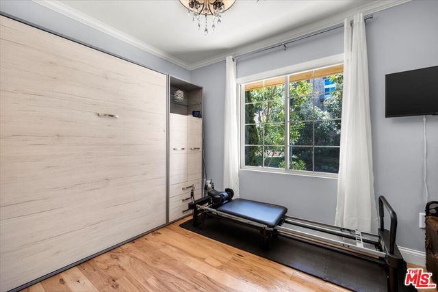 a bathroom with a double vanity sink a large mirror and shower