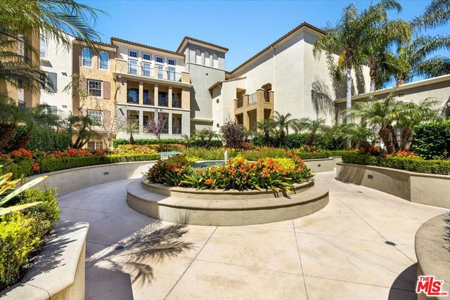 a view of a large buildings and a yard
