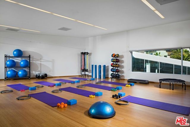 a view of a street with potted plants