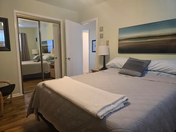 a bedroom with a bed and a table