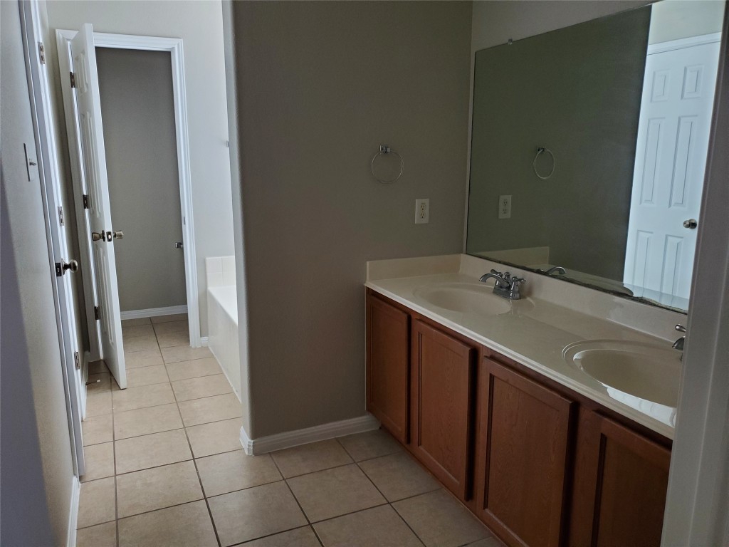 3701 Holden Court Round Rock, TX 78665 - Photo 12 of 21 a bathroom with a sink vanity and a mirror