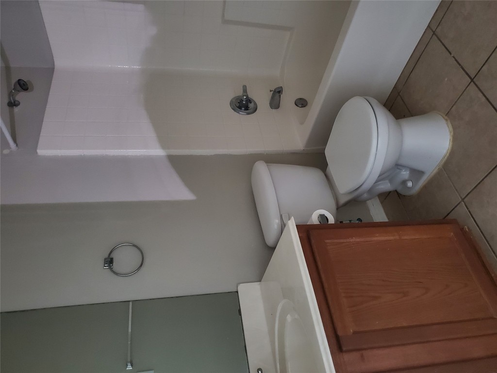 3701 Holden Court Round Rock, TX 78665 - Photo 18 of 21 a white toilet sitting next to a bath tub