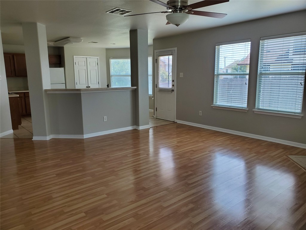 3701 Holden Court Round Rock, TX 78665 - Photo 2 of 21 an empty room with wooden floor and windows