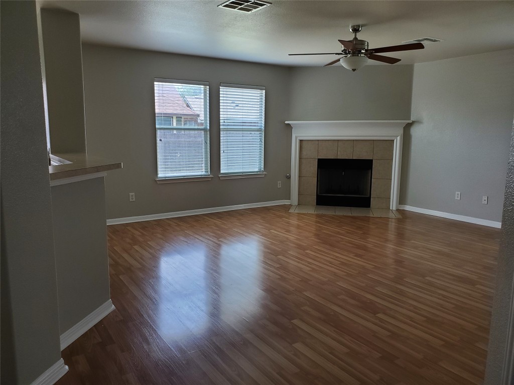 3701 Holden Court Round Rock, TX 78665 - Photo 3 of 21 a view of empty room with wooden floor and fireplace