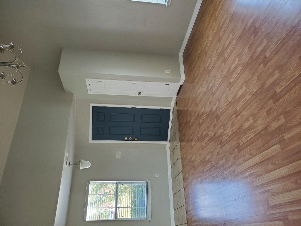 3701 Holden Court Round Rock, TX 78665 - Photo 8 of 21 an empty room with wooden floor and windows