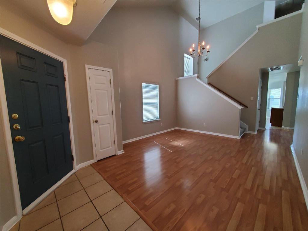 3701 Holden Court Round Rock, TX 78665 - Photo 10 of 21 a view of a hallway view with wooden floor and staircase