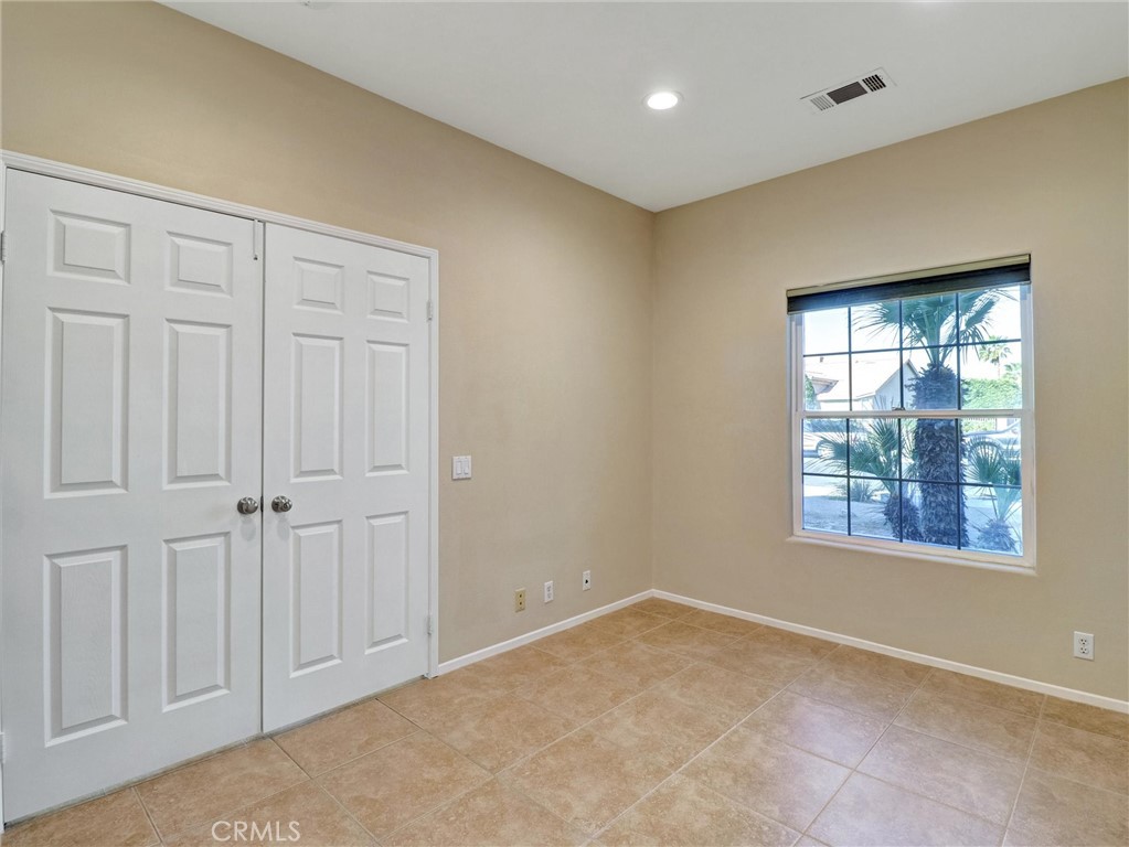 47718 Phoenix Street Indio, CA 92201 - Photo 15 of 54 a view of an empty room with a window