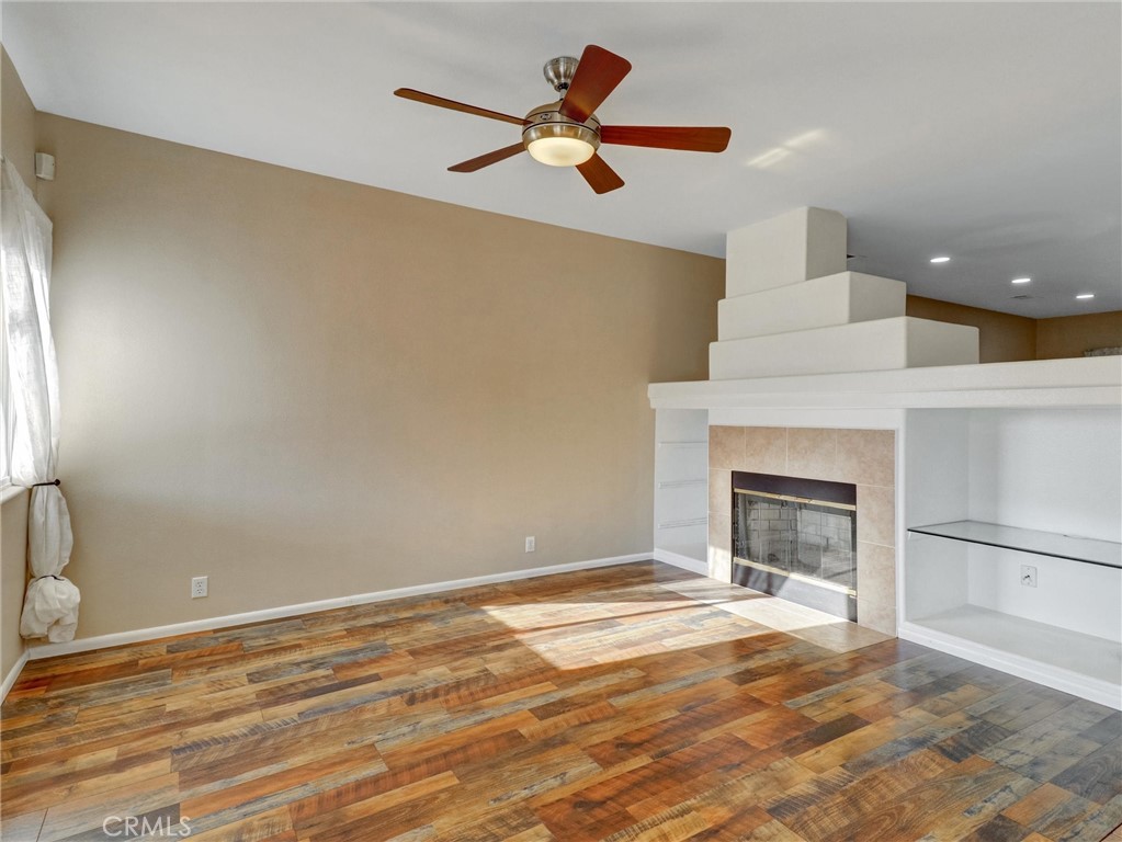 47718 Phoenix Street Indio, CA 92201 - Photo 20 of 54 a view of empty room with fireplace and fan