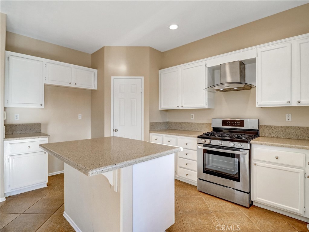 47718 Phoenix Street Indio, CA 92201 - Photo 23 of 54 a kitchen with a stove and a microwave