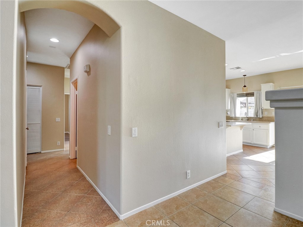 47718 Phoenix Street Indio, CA 92201 - Photo 26 of 54 a view of a kitchen cabinets and a refrigerator