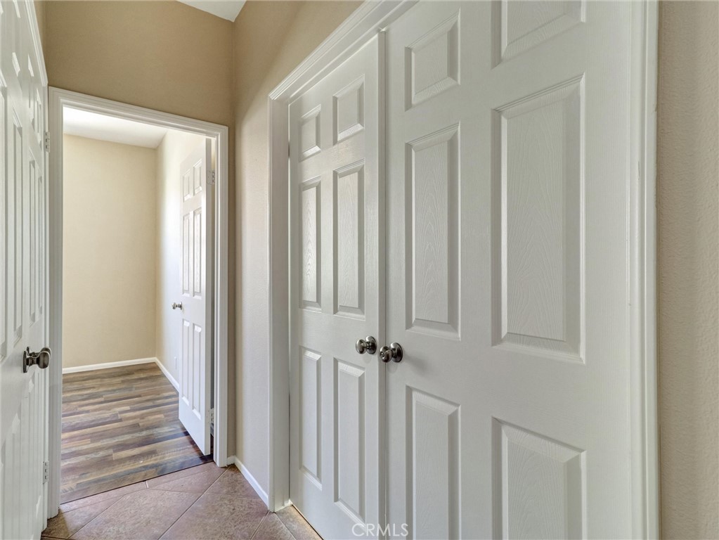 47718 Phoenix Street Indio, CA 92201 - Photo 31 of 54 a view of a hallway with wooden floor