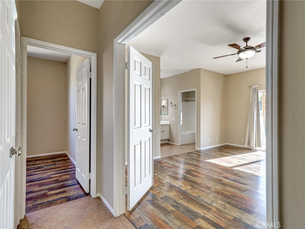 47718 Phoenix Street Indio, CA 92201 - Photo 32 of 54 a view of a hallway view with wooden floor and staircase