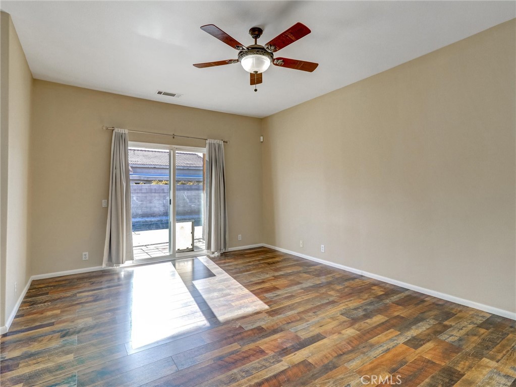 47718 Phoenix Street Indio, CA 92201 - Photo 34 of 54 wooden floor in an empty room with a window