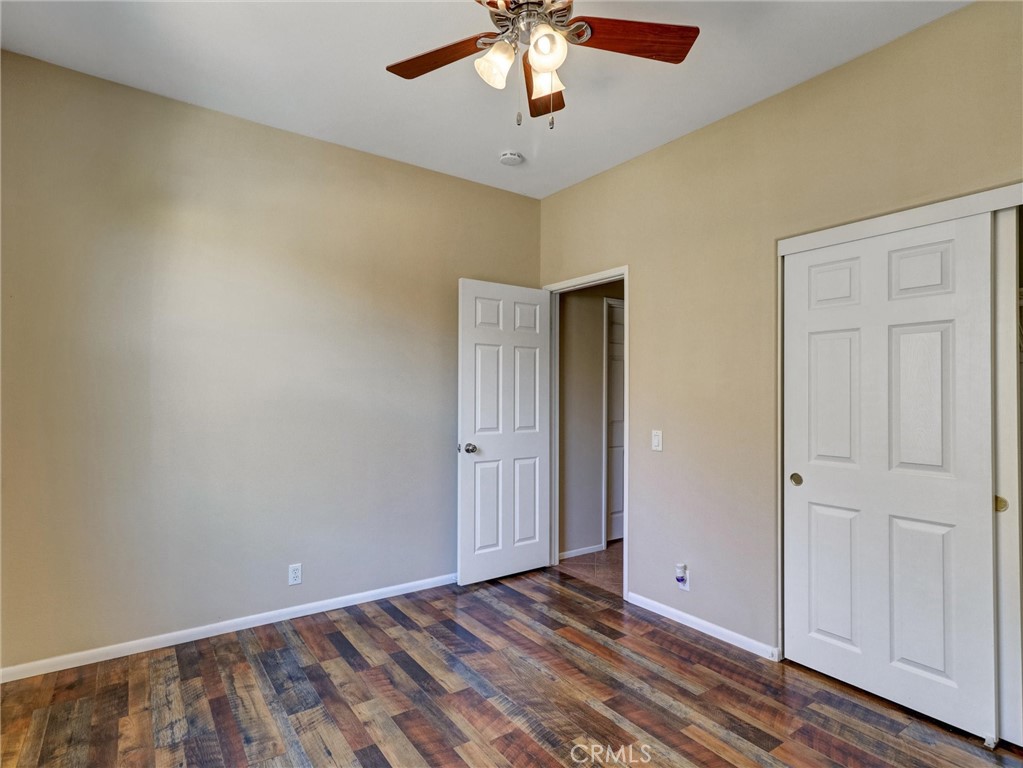 47718 Phoenix Street Indio, CA 92201 - Photo 42 of 54 a view of an empty room with wooden floor