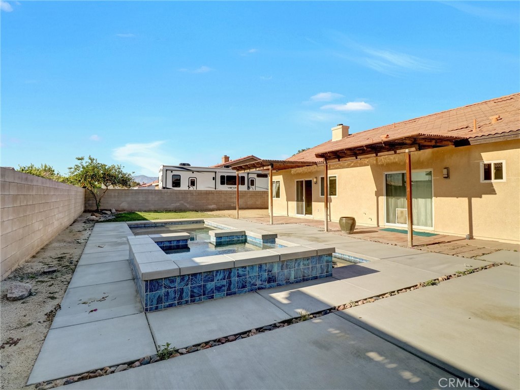 47718 Phoenix Street Indio, CA 92201 - Photo 47 of 54 a balcony with a table and chairs