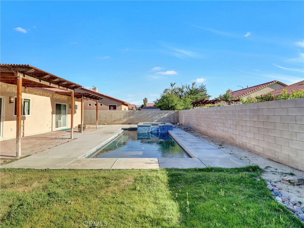 47718 Phoenix Street Indio, CA 92201 - Photo 50 of 54 a view of a house with a yard