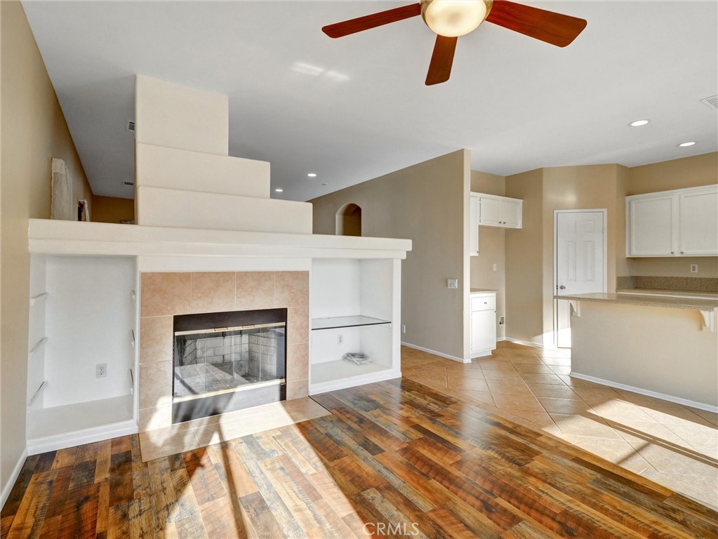 47718 Phoenix Street Indio, CA 92201 - Photo 5 of 54 a living room with furniture and a fireplace