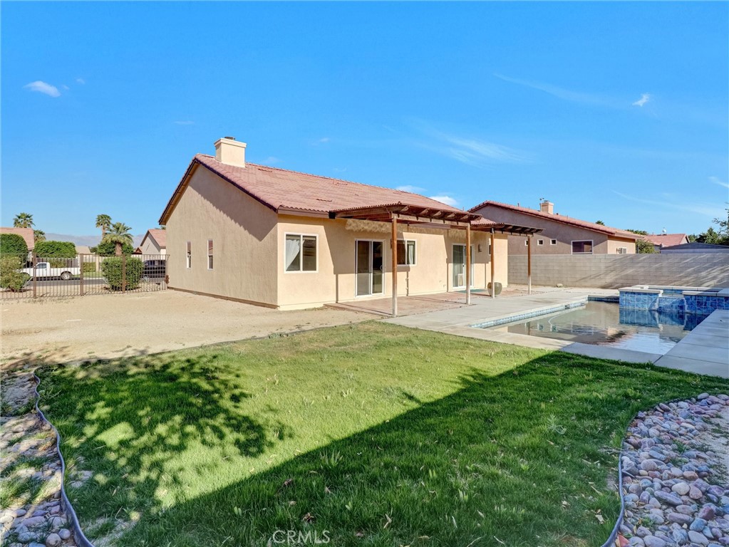 47718 Phoenix Street Indio, CA 92201 - Photo 51 of 54 a view of a house with a backyard