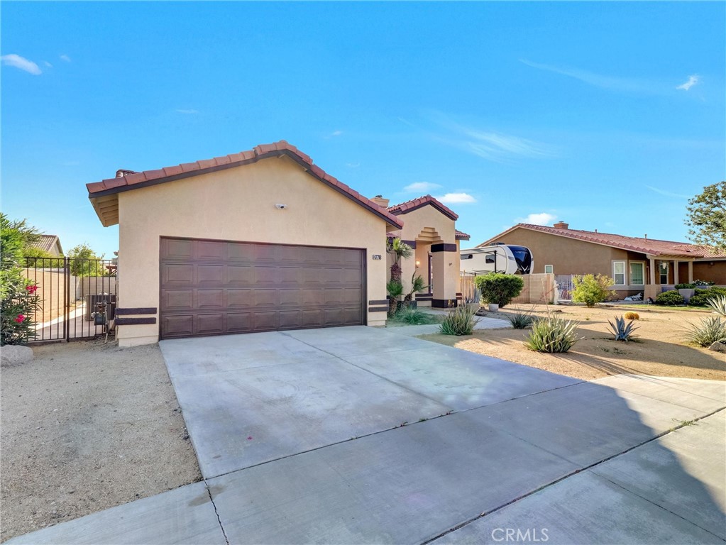 47718 Phoenix Street Indio, CA 92201 - Photo 54 of 54 a view of a house with a patio and a yard