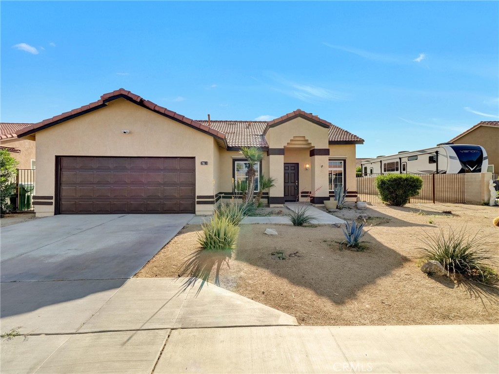 47718 Phoenix Street Indio, CA 92201 - Photo 8 of 54 a view of a house with a yard