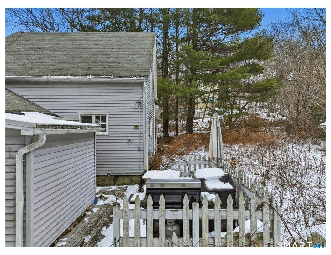 195 Bokum Road Old Saybrook, CT 06475 - Photo 4 of 30 a view of a patio with table and chairs with wooden floor and fence