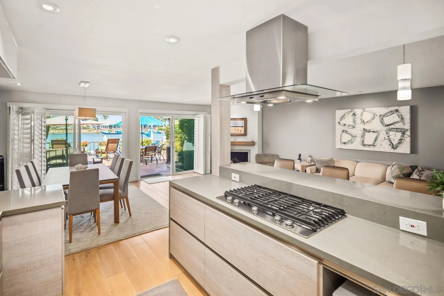 37 Antigua Court Coronado, CA 92118 - Photo 20 of 39 a kitchen with a stove a refrigerator and wooden floor