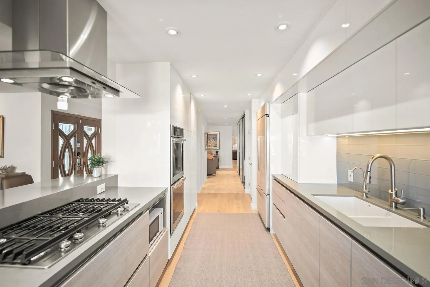 37 Antigua Court Coronado, CA 92118 - Photo 22 of 39 a large kitchen with stainless steel appliances granite countertop a lot of counter space and a sink