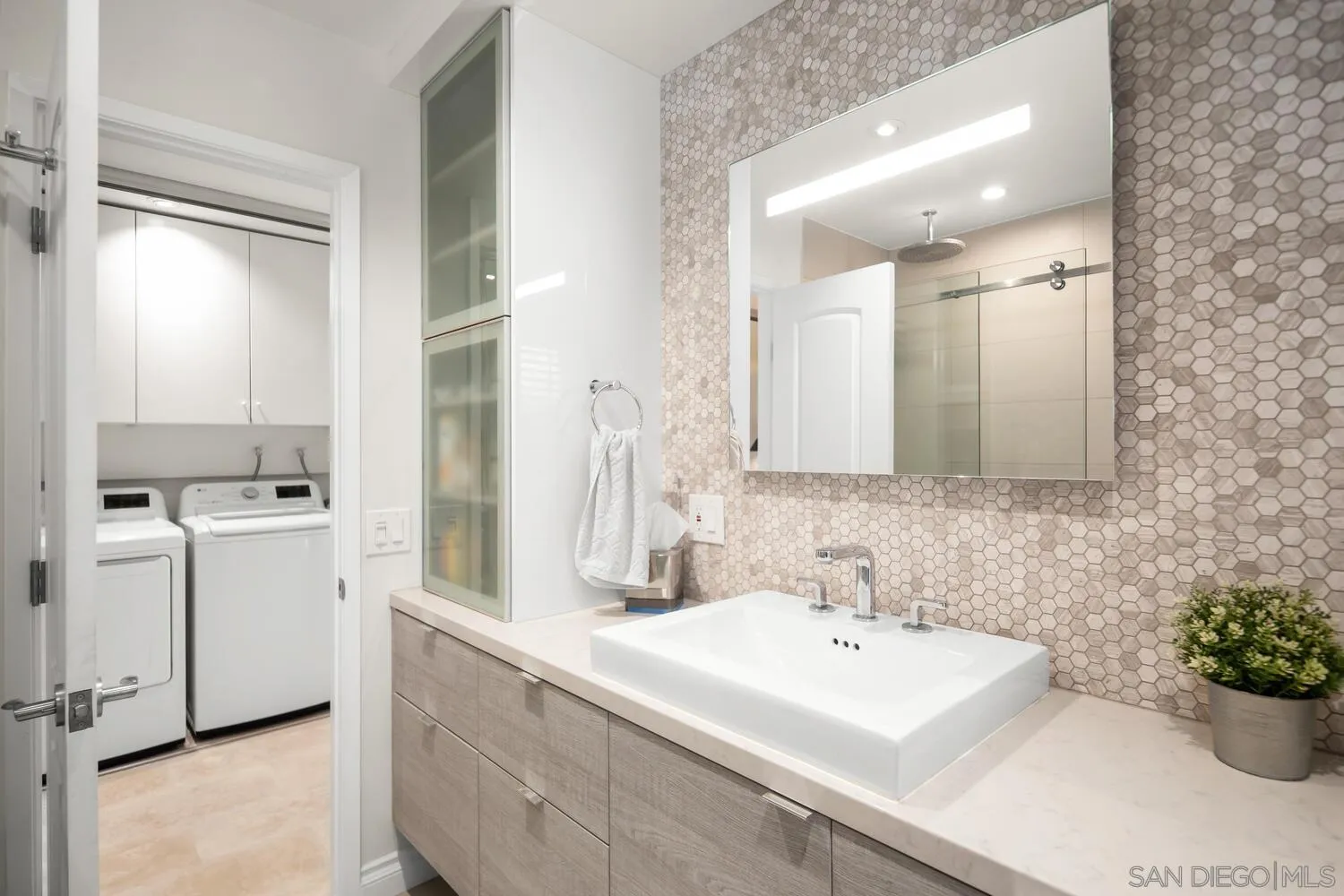 37 Antigua Court Coronado, CA 92118 - Photo 24 of 39 a bathroom with a sink and a mirror