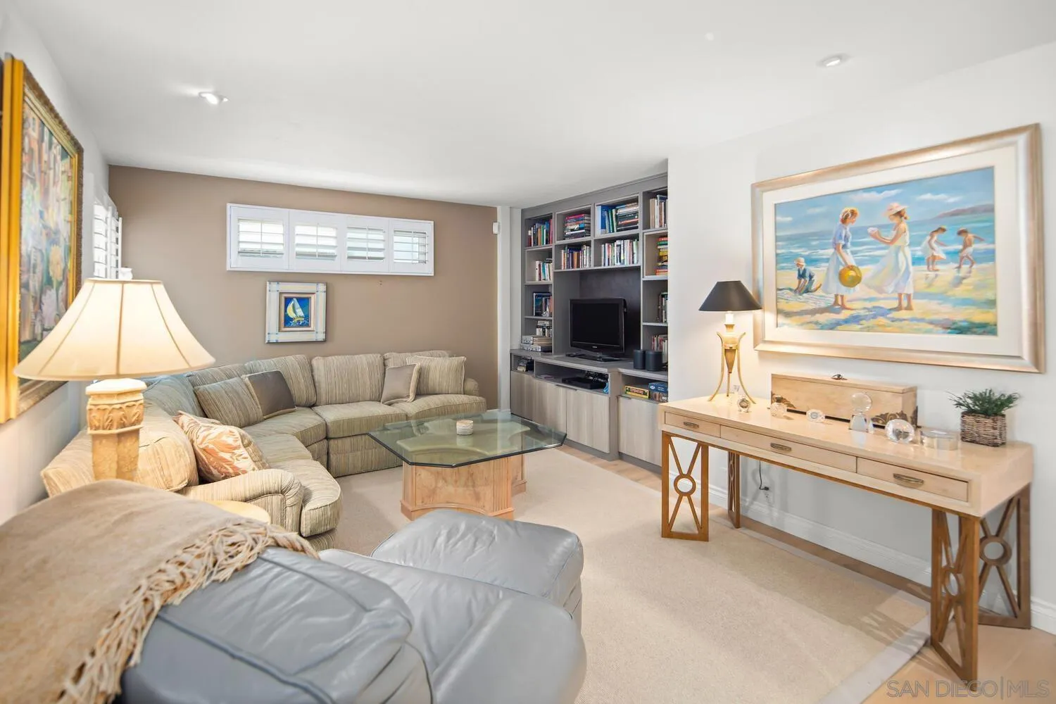 37 Antigua Court Coronado, CA 92118 - Photo 26 of 39 a living room with furniture a flat screen tv and a wall painting