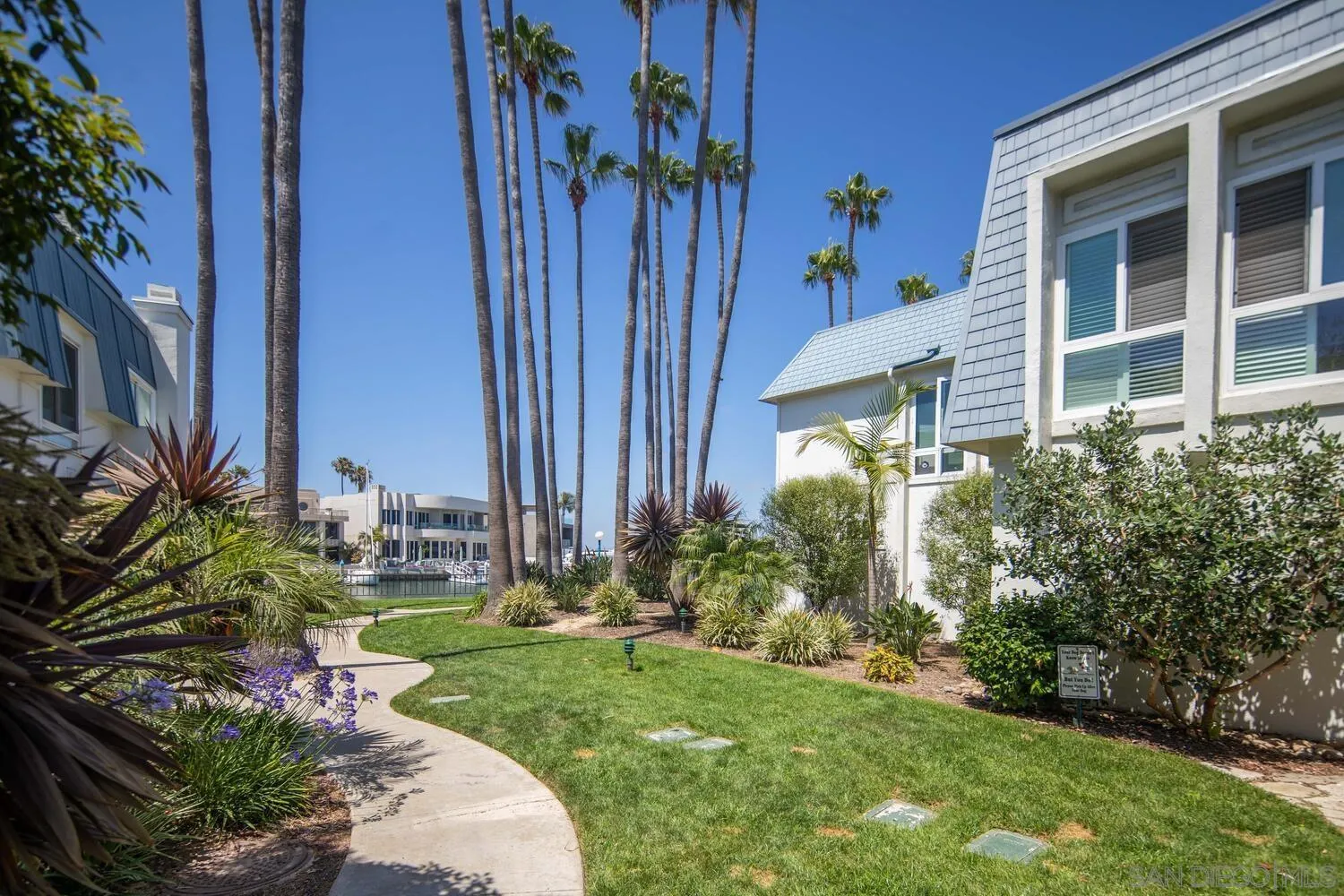 37 Antigua Court Coronado, CA 92118 - Photo 3 of 39 a view front of house with yard and seating area